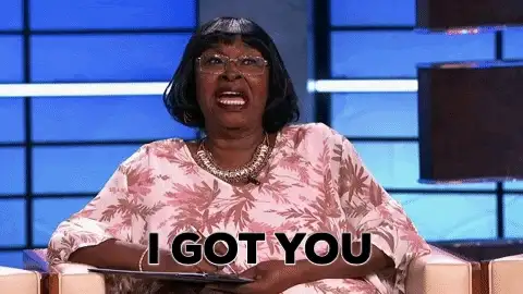 Animated GIF of a woman in a floral top on a talk show set with the caption I GOT YOU