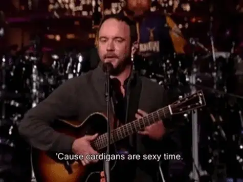 Man playing acoustic guitar at a microphone with caption ''Cause cardigans are sexy time.'