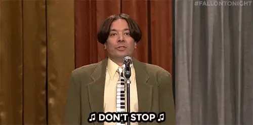 Animated GIF of a late night show host at a microphone with the caption Don't Stop