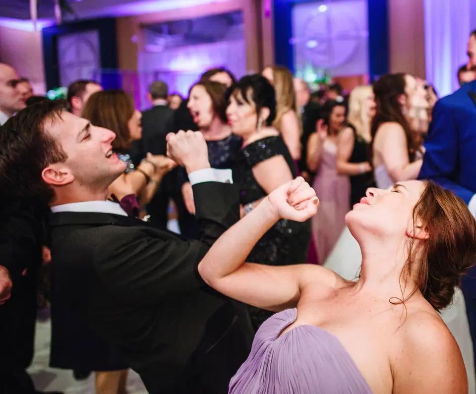Image of a group of people dancing on the dance floor